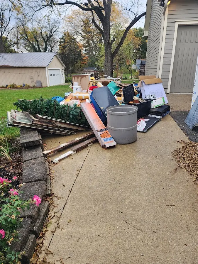 Dumpster being loaded with debris for Residential Dumpster Rental in Billings
